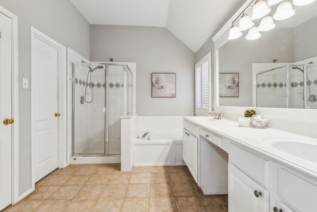 bathroom featuring tile patterned floors, vanity, lofted ceiling, and separate shower and tub