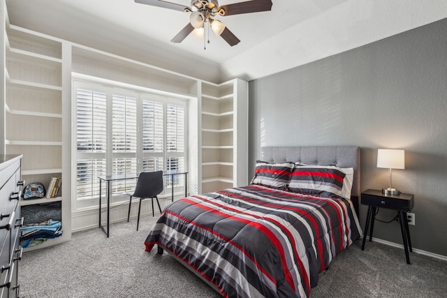 bedroom with vaulted ceiling, ceiling fan, and carpet flooring