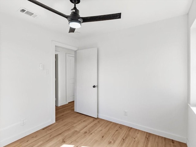 unfurnished bedroom with ceiling fan and light wood-type flooring