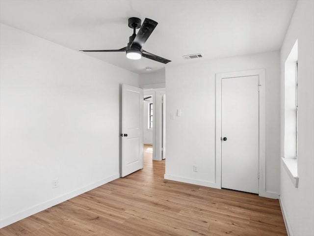 unfurnished bedroom featuring ceiling fan and light wood-type flooring