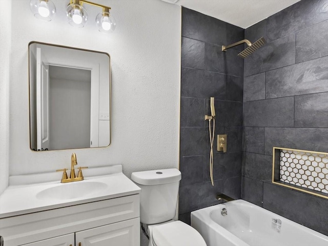 full bathroom with vanity, toilet, and tiled shower / bath combo