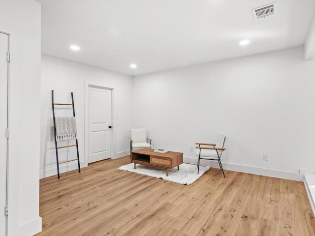 sitting room with light hardwood / wood-style flooring