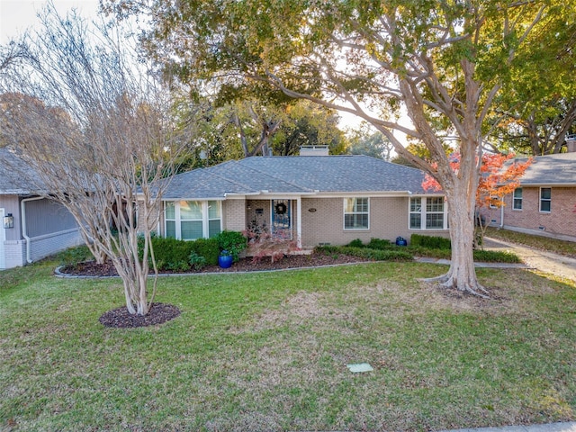 ranch-style home with a front yard