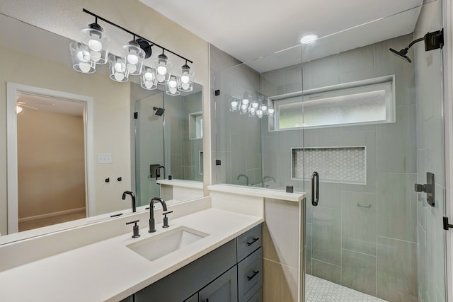 bathroom featuring vanity and an enclosed shower