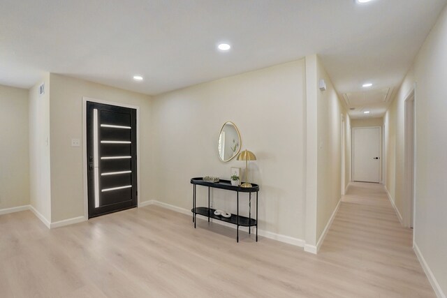 foyer with light hardwood / wood-style floors