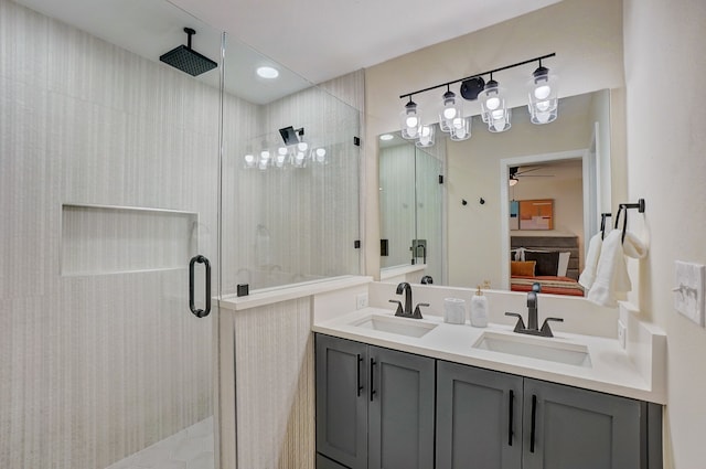 bathroom featuring ceiling fan, vanity, and an enclosed shower