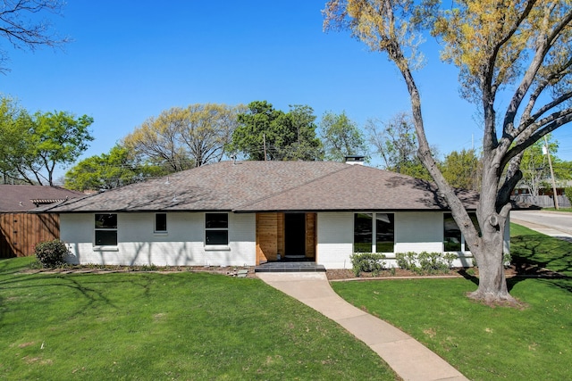 single story home featuring a front yard