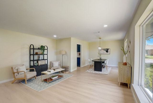 sitting room featuring light hardwood / wood-style floors