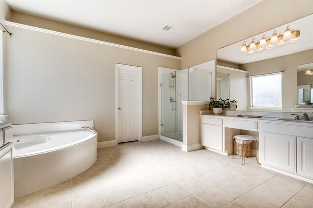 bathroom with tile patterned flooring, vanity, and separate shower and tub