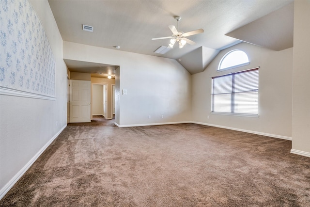 unfurnished room featuring ceiling fan, carpet, and lofted ceiling