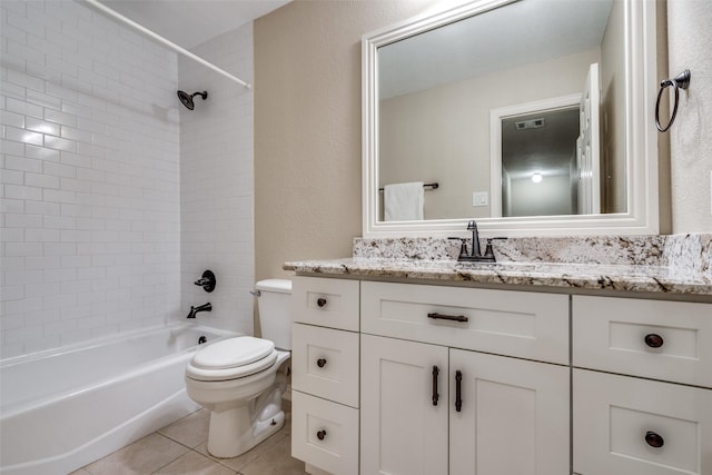 full bathroom with toilet, vanity, tiled shower / bath combo, and tile patterned flooring