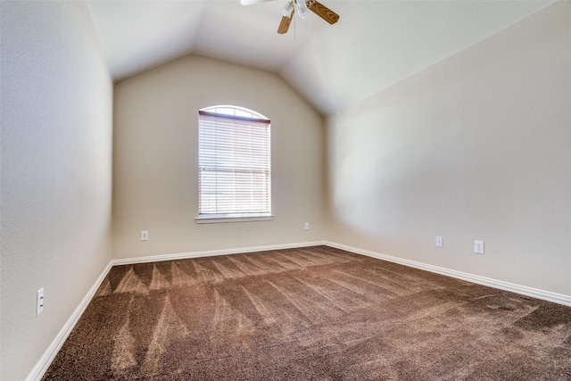 unfurnished room with carpet, ceiling fan, and vaulted ceiling