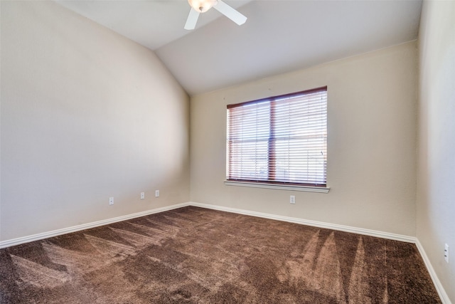 carpeted spare room with ceiling fan and lofted ceiling