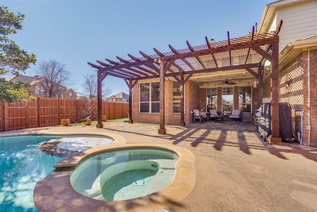 view of pool with a pergola, an in ground hot tub, ceiling fan, and a patio