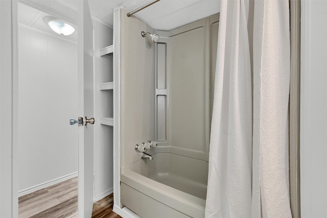 bathroom featuring shower / tub combo and wood-type flooring