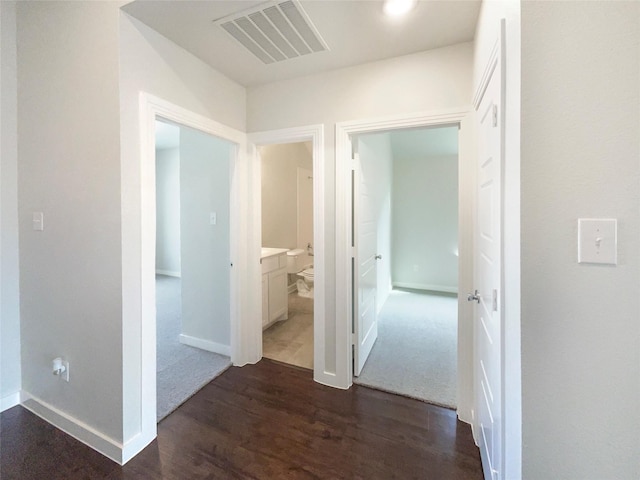 hall with dark hardwood / wood-style floors