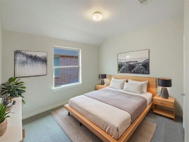 carpeted bedroom featuring vaulted ceiling