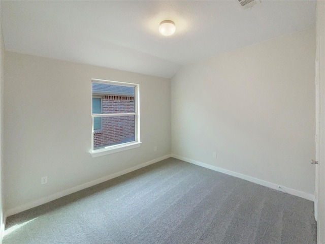 unfurnished room featuring carpet floors and lofted ceiling