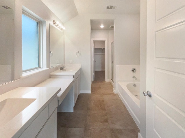 bathroom featuring vanity and separate shower and tub