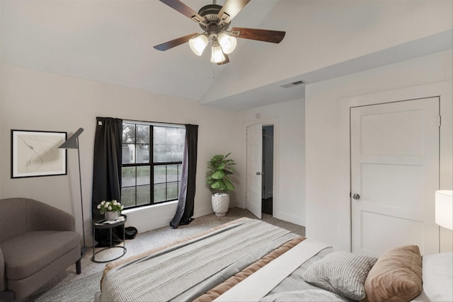 carpeted bedroom with vaulted ceiling and ceiling fan