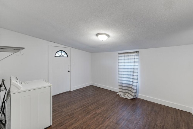 laundry room with plenty of natural light, washer / clothes dryer, dark hardwood / wood-style flooring, and a textured ceiling