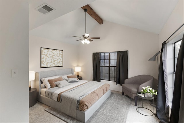 carpeted bedroom featuring vaulted ceiling with beams and ceiling fan