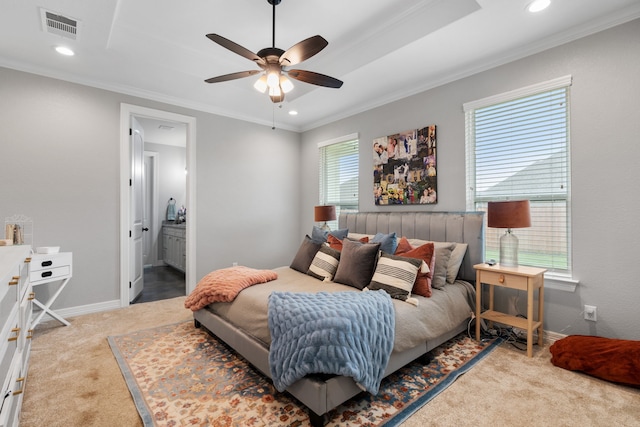 bedroom featuring ensuite bath, ceiling fan, crown molding, and light carpet