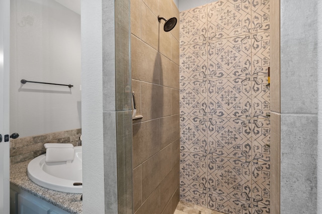 bathroom with tiled shower