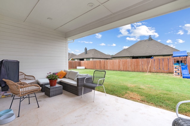 view of patio with an outdoor living space and a playground