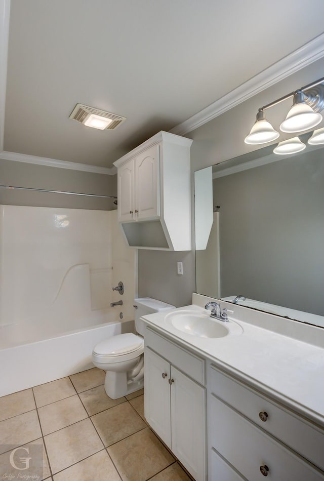 full bathroom featuring tile patterned floors, toilet, bathtub / shower combination, ornamental molding, and vanity