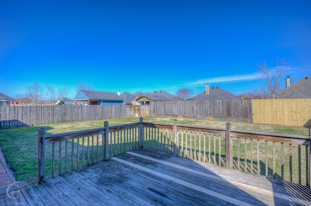 wooden deck with a lawn