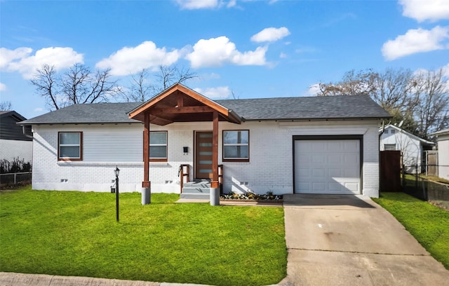 view of front of property with a garage and a front lawn