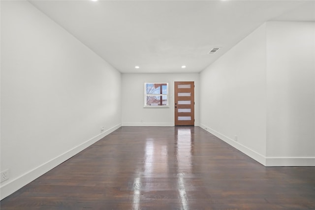 foyer entrance featuring dark hardwood / wood-style flooring