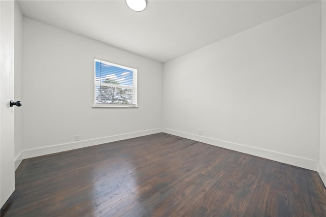 spare room featuring dark hardwood / wood-style floors