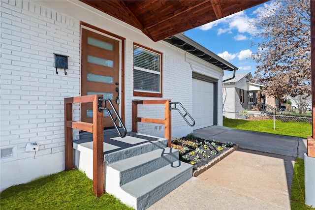 view of exterior entry featuring a garage