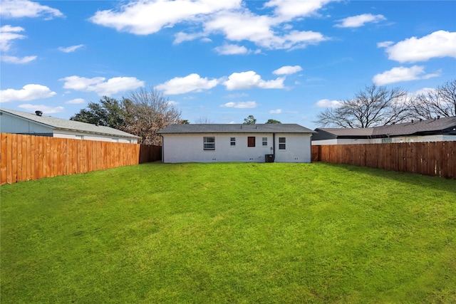 back of property featuring a yard