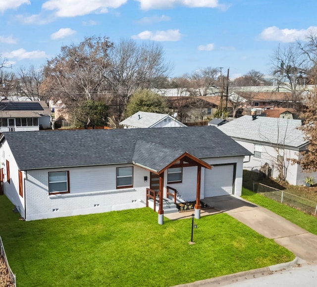 view of front of property with a front yard and a garage