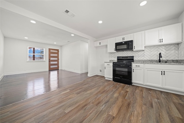 kitchen with white cabinetry, dark wood-type flooring, and black appliances