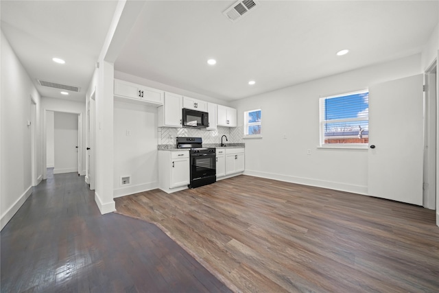 kitchen featuring black appliances, decorative backsplash, white cabinetry, and dark wood-type flooring