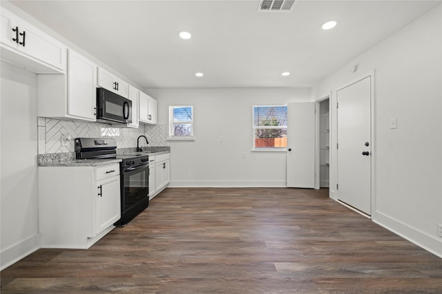 kitchen featuring white cabinetry, dark hardwood / wood-style flooring, and black appliances