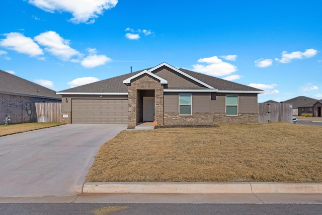 view of front of home featuring a front lawn and a garage