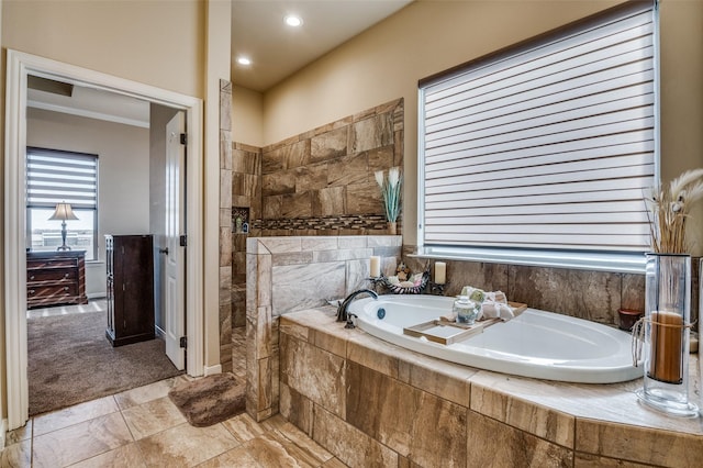 bathroom with tiled bath and vanity