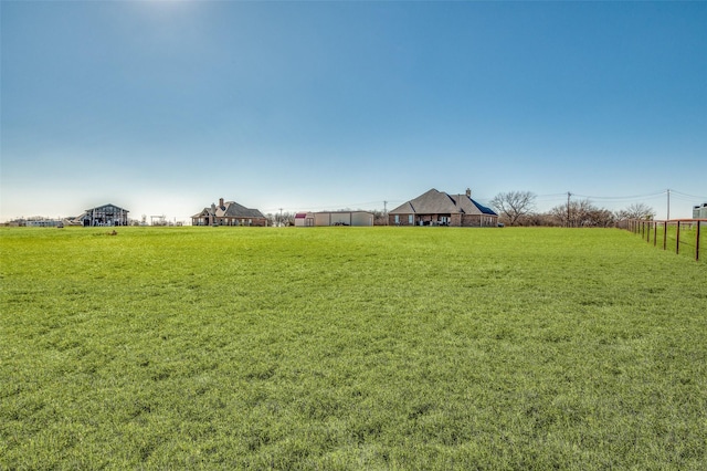 view of yard with a rural view