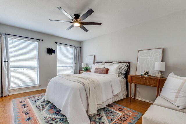 bedroom featuring hardwood / wood-style flooring and ceiling fan