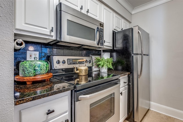 kitchen with white cabinetry, crown molding, and appliances with stainless steel finishes