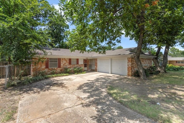 ranch-style home featuring a garage