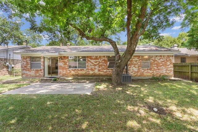 back of house featuring a yard, a patio, and central air condition unit