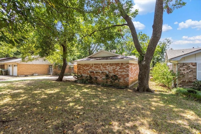 view of property exterior featuring a lawn