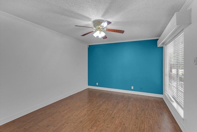 empty room featuring hardwood / wood-style floors, ceiling fan, crown molding, and a textured ceiling