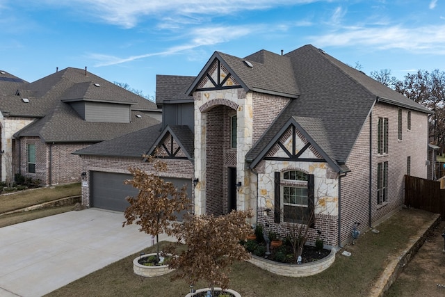 view of front of house with a garage and a front yard